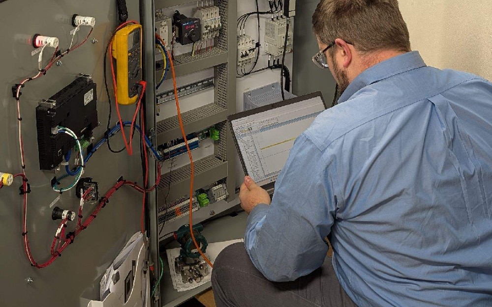 A technician conducting a control system upgrade