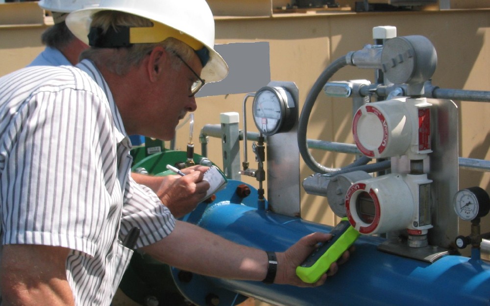 Technicians working on maintenance for an existing system