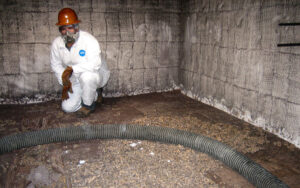 Technician working on media replacement at a recycling plant