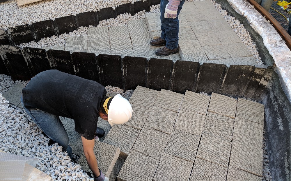 Field techs working on Regenerative Thermal Oxidizer ceramic media change