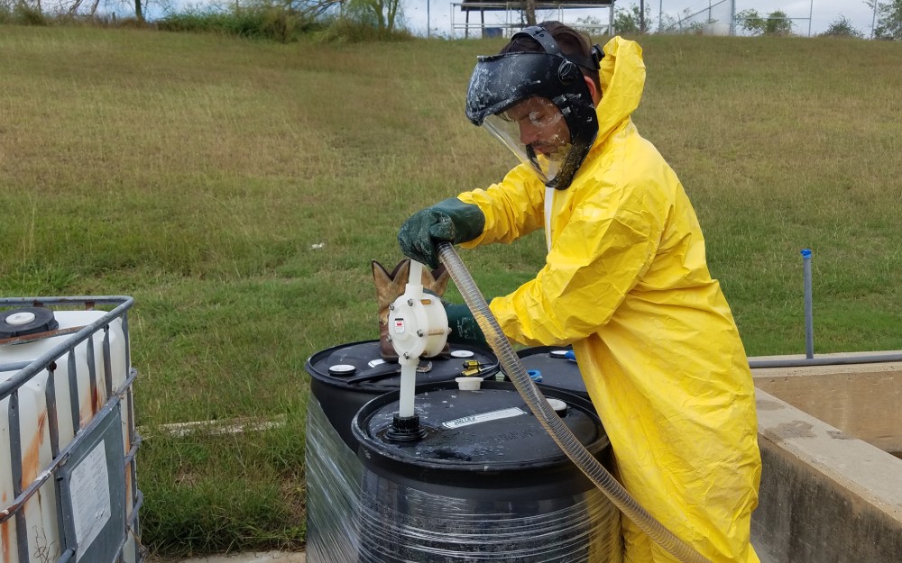 Technician conducting wet scrubber cleaning
