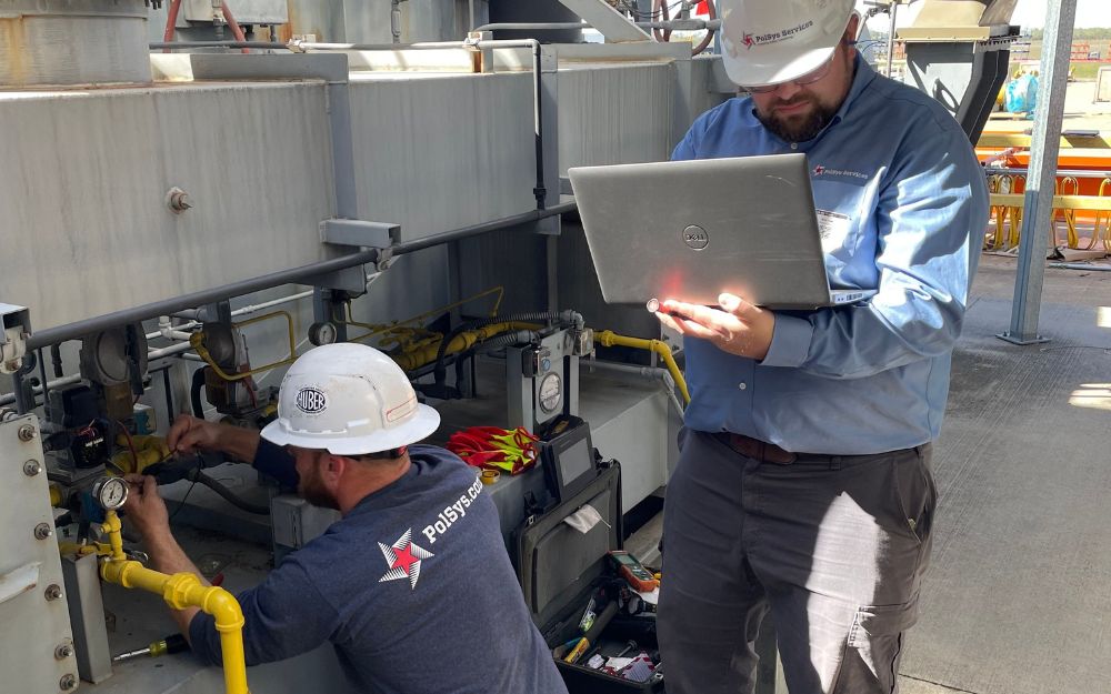PolSys technicians inspecting equipment
