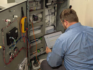 Technician conducting control system upgrade